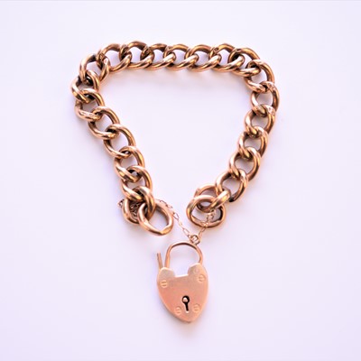 Lot 74 - A yellow metal hollow curb link bracelet