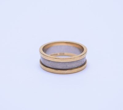 Lot 48 - An 18ct yellow and white gold wedding band