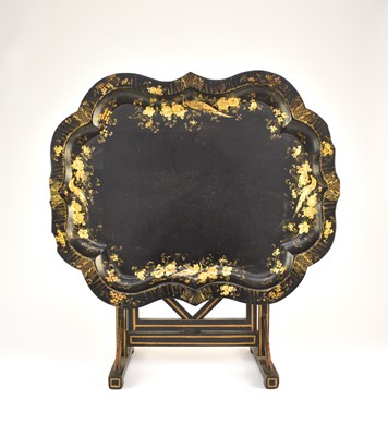 Lot 560 - A Victorian papier mache tray on later stand
