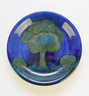 Lot 259 - A William Moorcroft 'Moonlit Blue' plate, circa 1925
