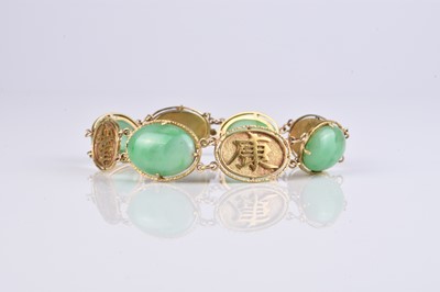 Lot 151 - A Chinese yellow metal and jadeite panel bracelet