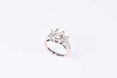 Lot 183 - A graduated emerald cut three stone diamond ring