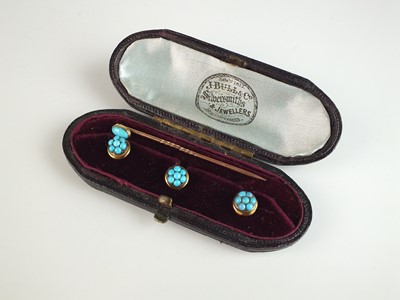 Lot 218 - A set of three turquoise studs and a turquoise stick pin