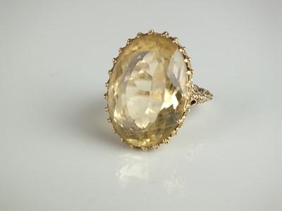 Lot 230 - A 9ct gold citrine dress ring