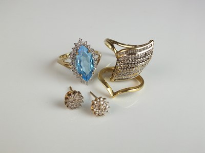 Lot 330 - Three rings and a pair of earrings