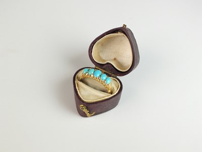 Lot 240 - An Edwardian 18ct gold five stone turquoise ring