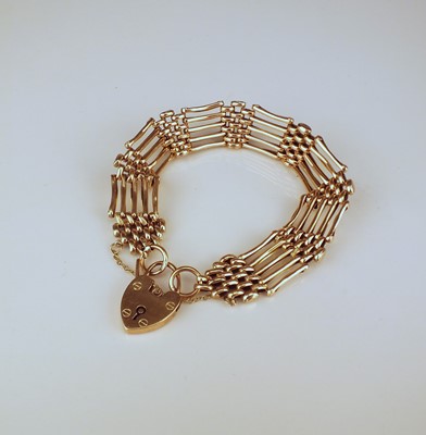 Lot 322 - A yellow metal five bar gate link bracelet