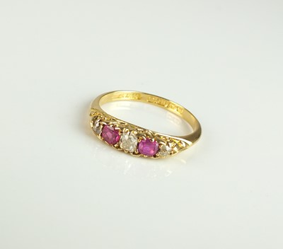 Lot 284 - An Edwardian 18ct gold five stone diamond and untested ruby ring