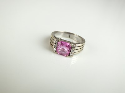 Lot 235 - A pink sapphire and diamond ring