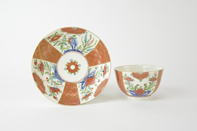 Lot 56 - A Caughley 'Scarlet and Gold Japan' tea bowl and saucer, circa 1785-90