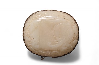 Lot 62 - A Chinese nephrite jade and bronze-mounted hand mirror, Qing Dynasty