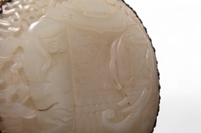 Lot 62 - A Chinese nephrite jade and bronze-mounted hand mirror, Qing Dynasty