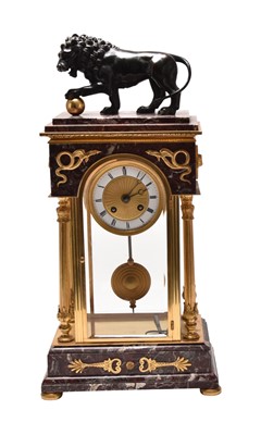 Lot A French Empire style ormolu, bronze and marble mantel clock