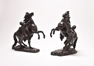 Lot 197 - A pair of late 19th/early 20th century French patinated bronze models of the Marley Horses