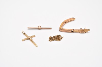 Lot 242 - A broken expandable watch bracelet, a yellow metal T-bar and a crucifix pendant