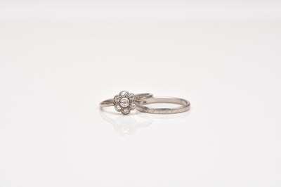 Lot 271 - An early 20th century diamond floral cluster ring and a wedding band
