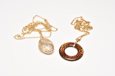 Lot 128 - Two pendants on chains