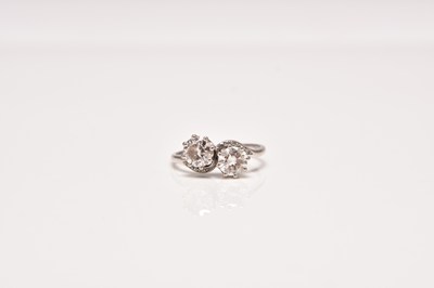 Lot 125 - A mid-20th century two stone diamond crossover ring