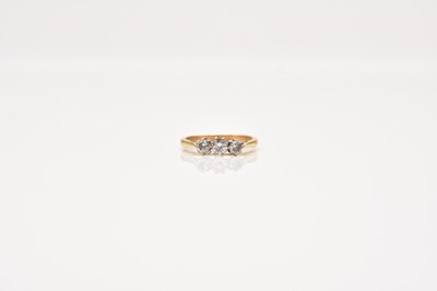 Lot 155 - A graduated three stone diamond ring
