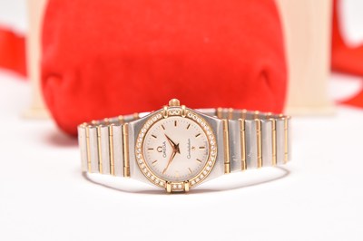 Lot 344 - Omega: A lady's bi-metal diamond set Constellation bracelet watch