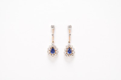 Lot 203 - A pair of Edwardian style sapphire and diamond pear shaped ear pendants