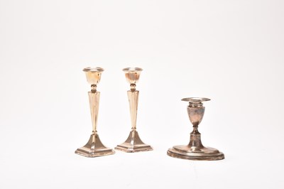 Lot 38 - Three silver mounted candlesticks