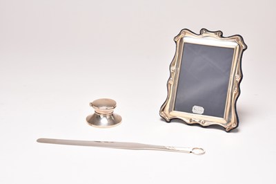 Lot 86 - A silver page turner, a silver mounted frame and a silver inkwell