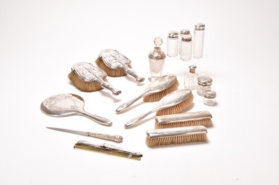 Lot 82 - A collection of silver mounted dressing table wares