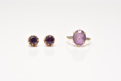 Lot 318 - An 18ct gold amethyst ring and a pair of 9ct gold amethyst earrings