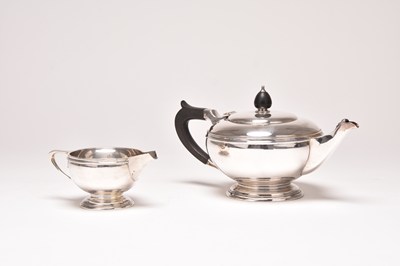 Lot 45 - A silver teapot and cream jug