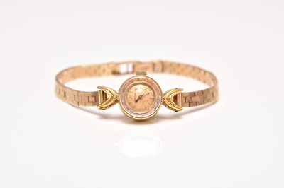 Lot 342 - Omega: A lady's 18ct gold watch on a 9ct gold bracelet