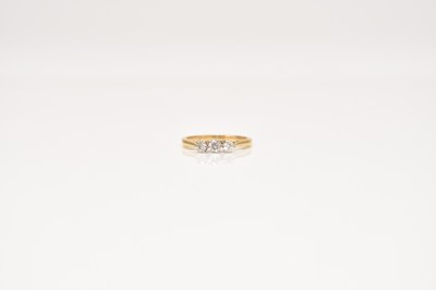 Lot 310 - A three stone diamond ring