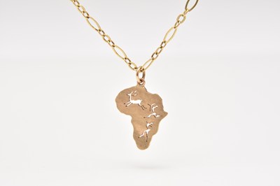 Lot 179 - A yellow metal Capricorn pendant on chain