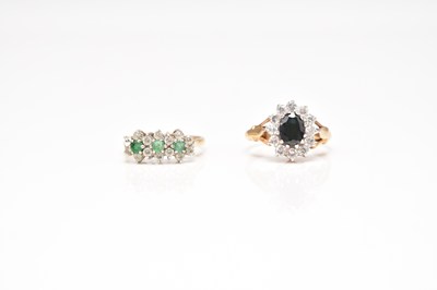 Lot 141 - A 9ct gold emerald and white stone cluster ring