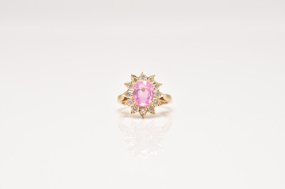 Lot 229 - A untested pink sapphire and diamond cluster ring
