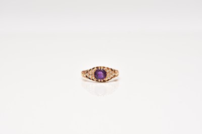 Lot 233 - An Edwardian 18ct gold amethyst and diamond ring