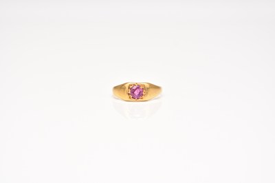 Lot 211 - A 22ct gold untested pink sapphire set signet ring