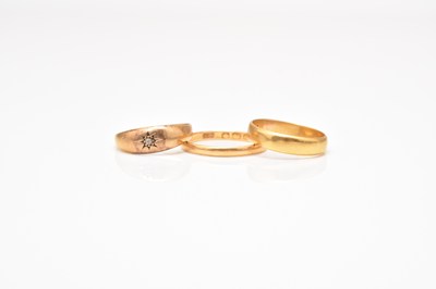 Lot 279 - Two 22ct gold wedding bands and an 18ct gold ring