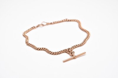 Lot 122 - A 9ct rose gold curb link albert chain