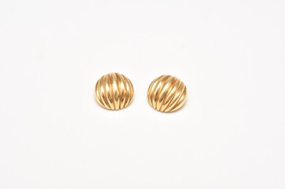 Lot 144 - A pair of yellow metal clip earrings
