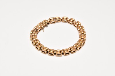 Lot 212 - A yellow metal bead and brick link bracelet