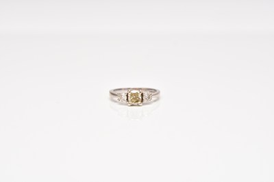 Lot 300 - An 18ct white gold graduated three stone diamond ring