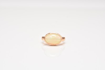 Lot 296 - A 14ct rose gold single stone opal ring