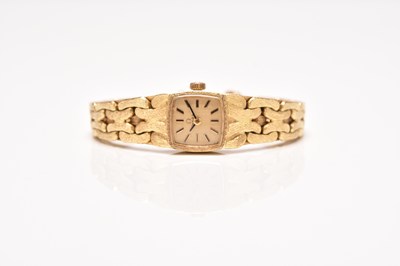 Lot 341 - Omega: A lady's 18ct gold bracelet watch