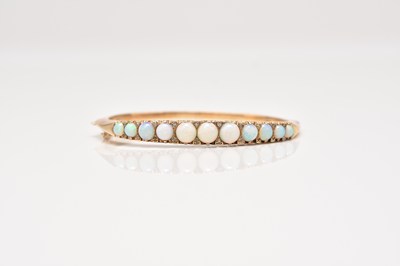 Lot 168 - A Victorian style 9ct gold opal and diamond bangle