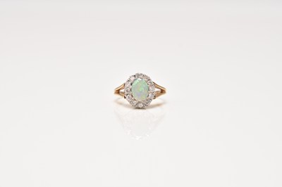 Lot 299 - A 9ct gold opal and diamond cluster ring