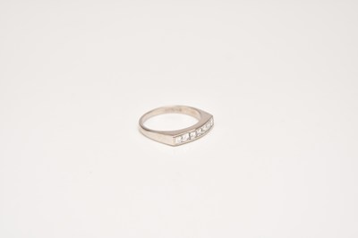 Lot 220 - An 18ct white gold square cut diamond half eternity ring