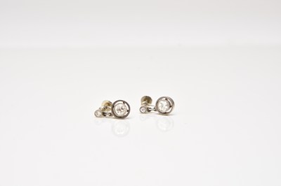 Lot 132 - A pair of early 20th century diamond earrings