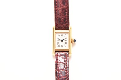 Lot 346 - Cartier: A lady's 18ct gold Tank quartz wristwatch