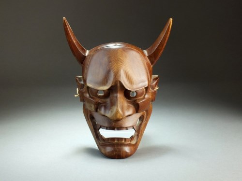 Lot 247 - A Japanese carved wood oni mask, Taisho period,...